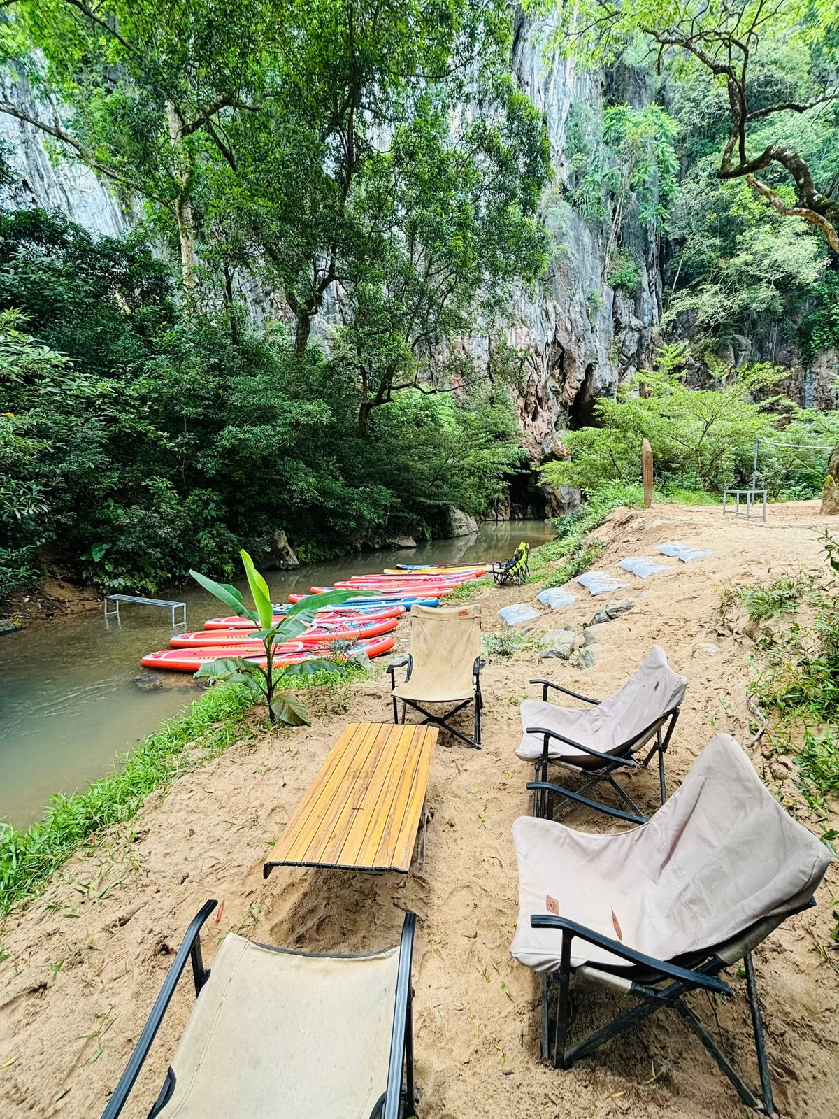 Hot lunch at E Cave campsite beside jungle stream, Moc Nam tour
